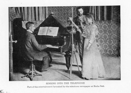 SINGING INTO THE TELEPHONE
Part of the entertainment furnished by the telephone newspaper at Buda-Pest.