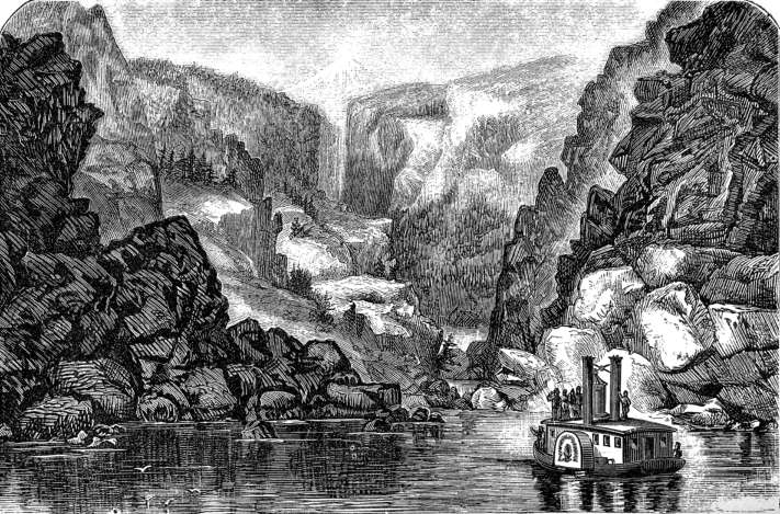 Small steam
boat cruising in gorge amidst towering buttes.